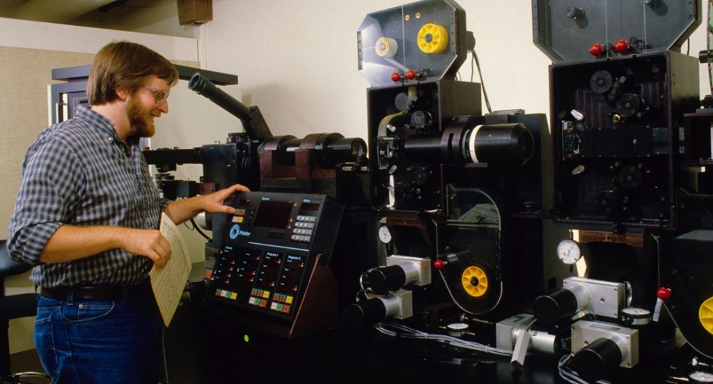 Ken Smith at the controls of ILM’s “Workhorse” optical printer. Photograph courtesy of ILM.